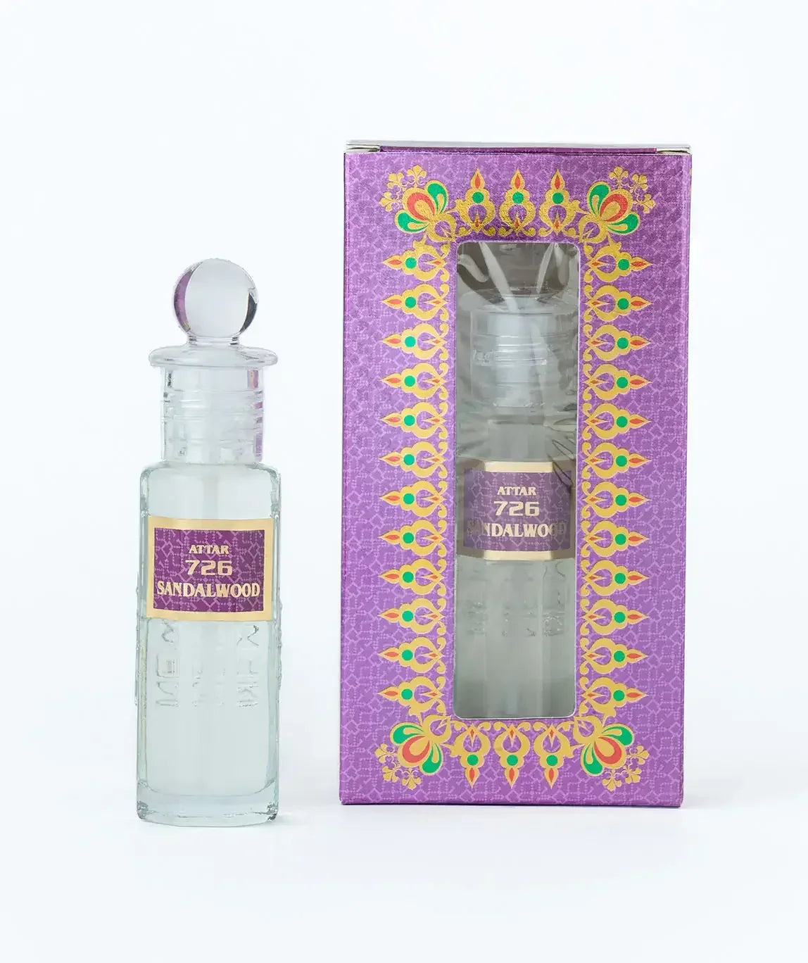 Sandalwood attar perfume in clear glass bottle with decorative purple box, labeled 726.