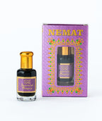 Attar 726 Jannatul Baquie perfume oil bottle with decorative purple packaging