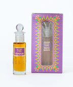 Attar 726 Status perfume oil bottle with decorative purple box, clear cap, amber liquid