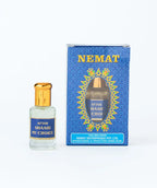 Attar Shaahi My Choice perfume oil bottle with gold cap and decorative blue packaging