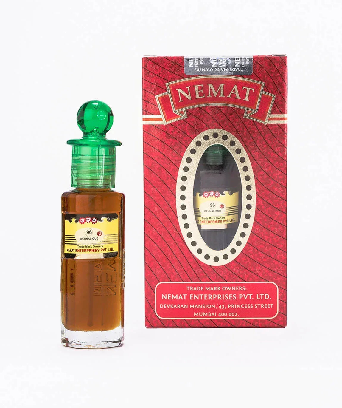 Denal Oud perfume oil bottle with green cap next to red Nemat box packaging