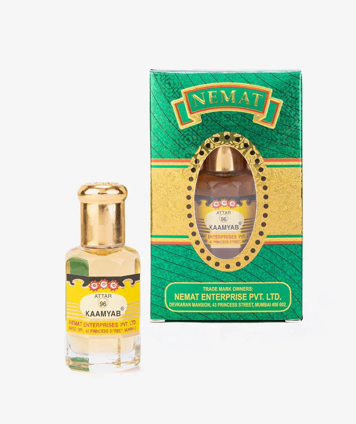 Attar 96 Kaamyab perfume oil bottle with gold cap next to matching green and gold box