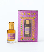 Attar 726 Status perfume oil bottle with gold cap and decorative purple packaging