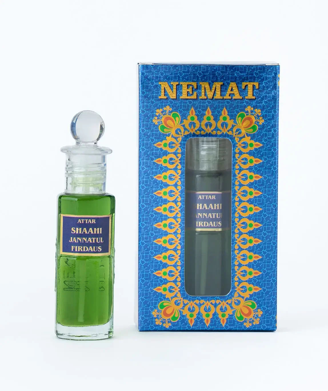 Green attar perfume bottle with ornate blue box labeled Shaahi Jannatul Firdaus